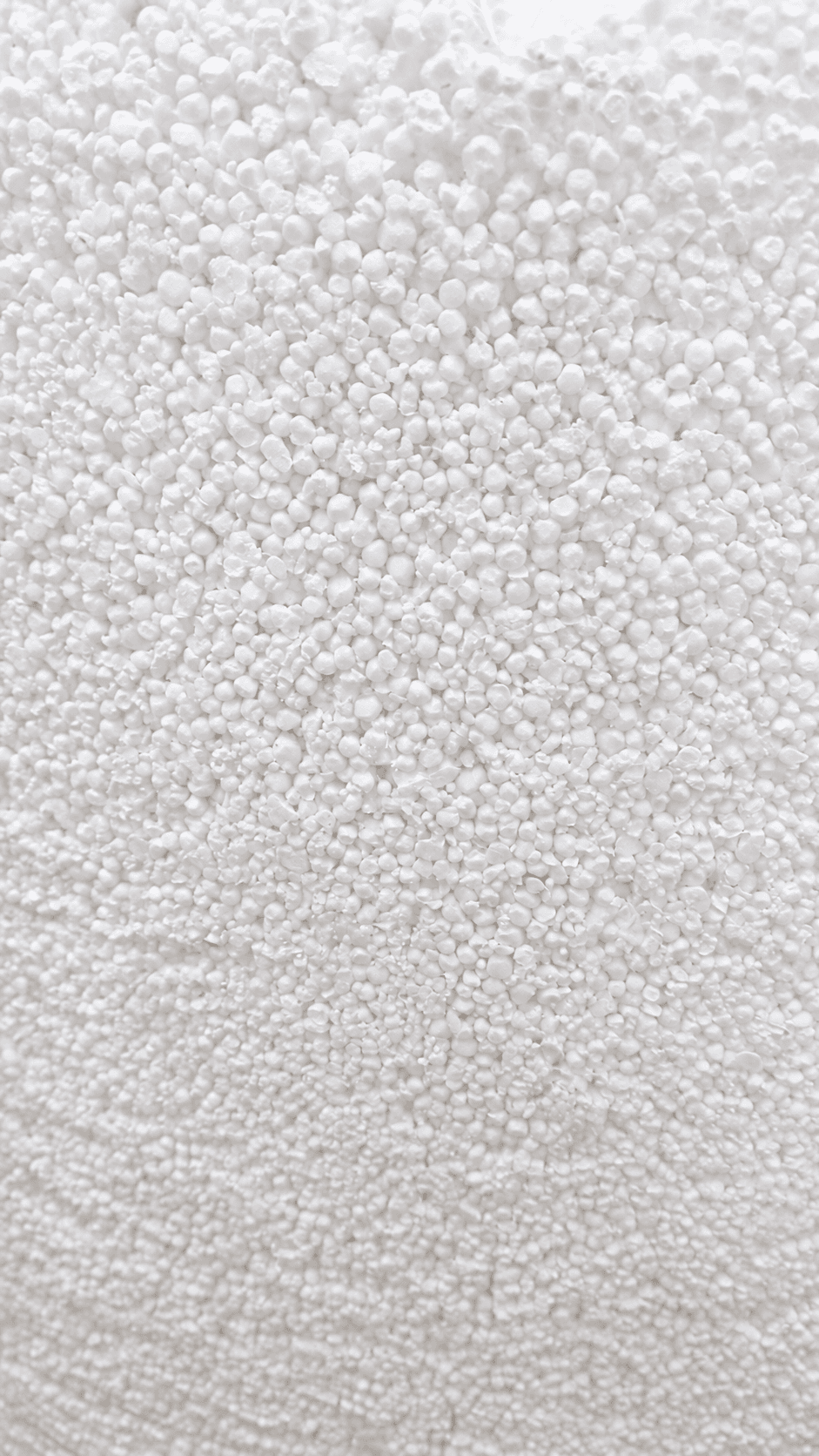 Close-up of white EPS regrind filling with irregular particles